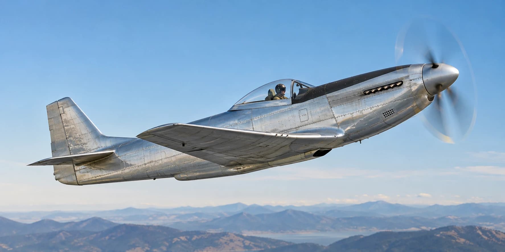 A classic silver propeller aircraft climbing above distant mountains, with riveted panels, a single cockpit, and the propeller blurred in rotation. Original AI-generated image.